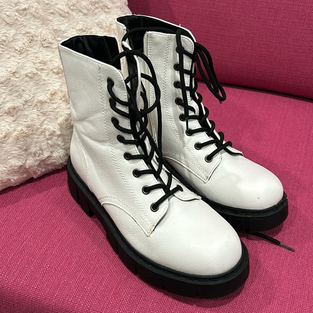 White combat boots similar in style to Dr Martens